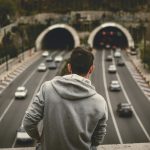 Man looking at the freeway in Tehran